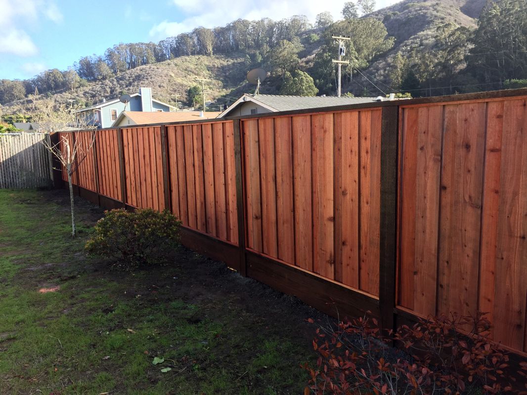 Wood fence with dark stained posts