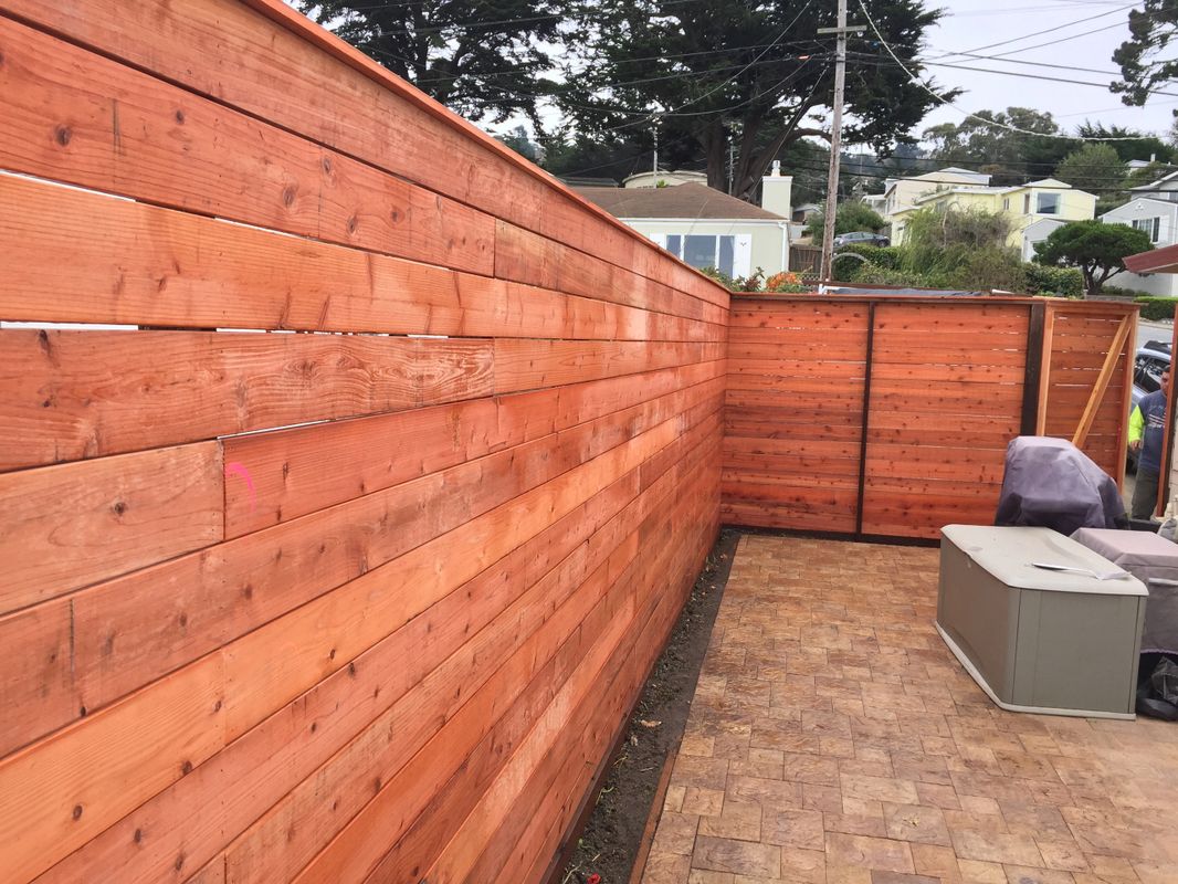 Horizontal wood slat fence
