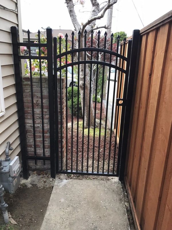 Decorative iron gate with arch top