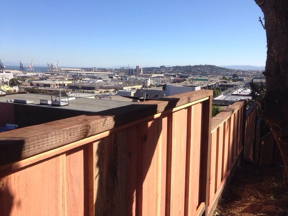 Wood privacy fence installation