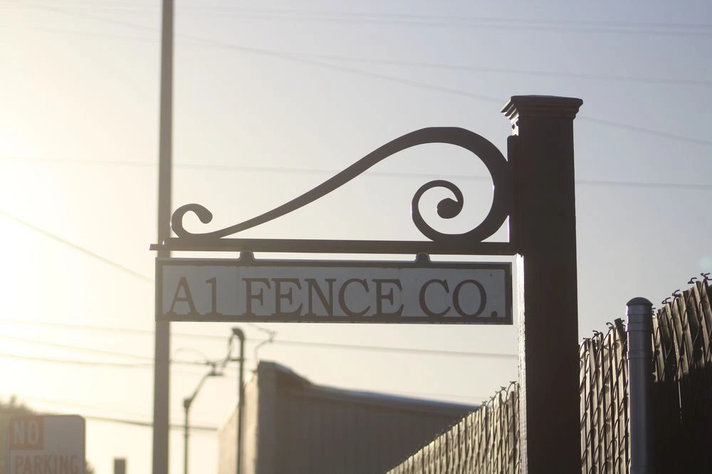 Wrought iron fence and sign