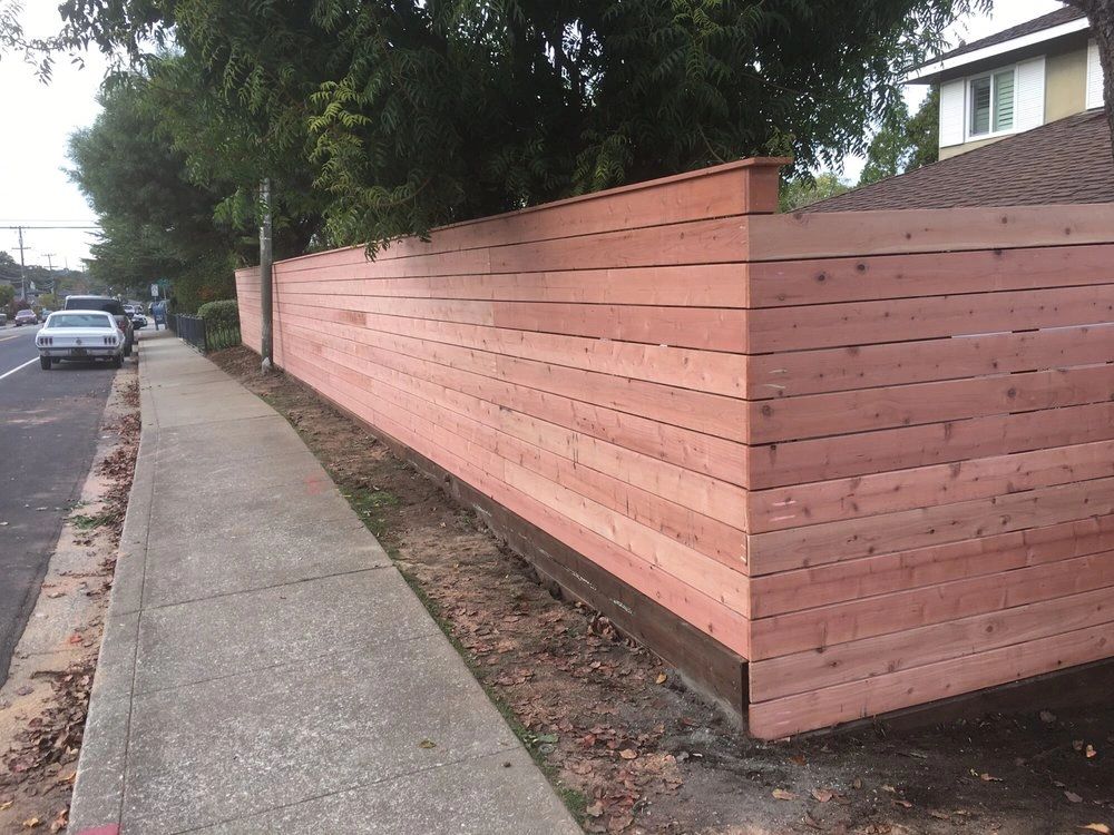 Louvered wood fence
